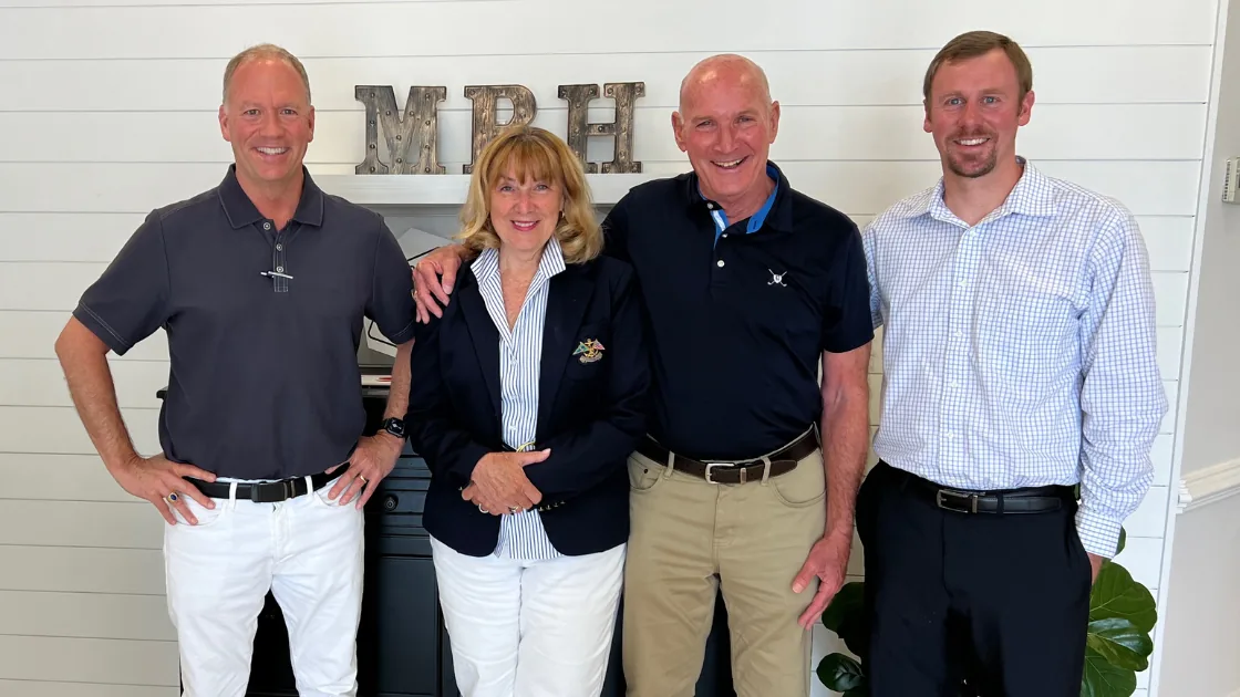 The Bill Denny Real Estate Group with clients at the MBH Settlement Group office after a closing