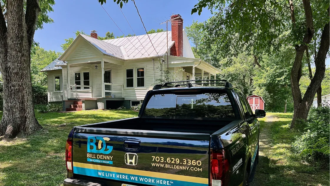 A Bill Denny Real Estate Group truck parked in front of a listed home in Gainesville, VA