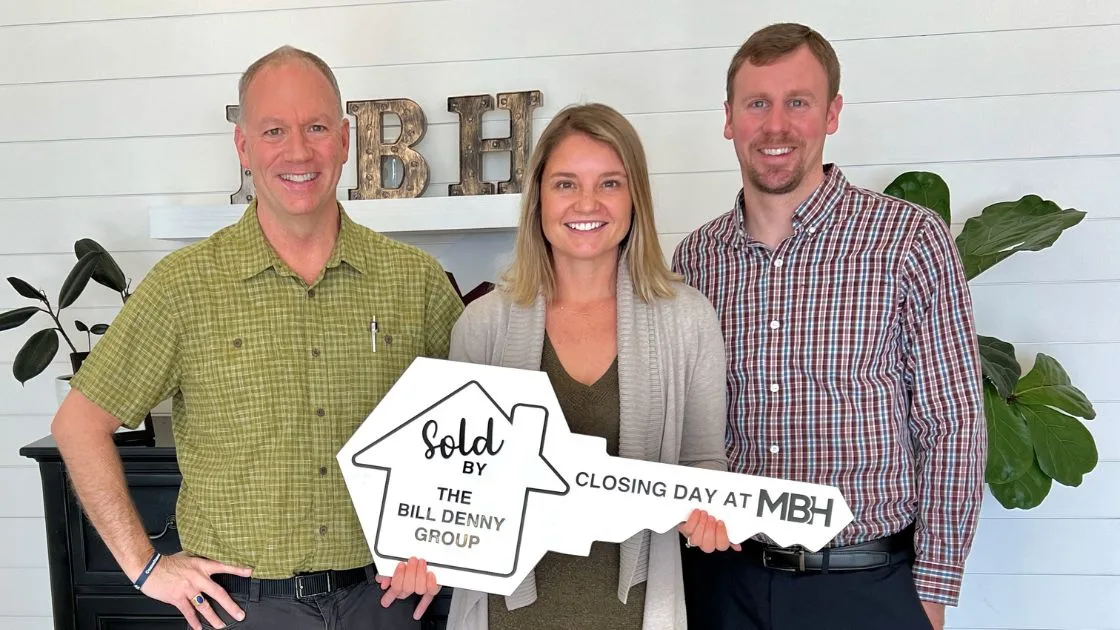 The Bill Denny Real Estate Group celebrating a closing at MBH