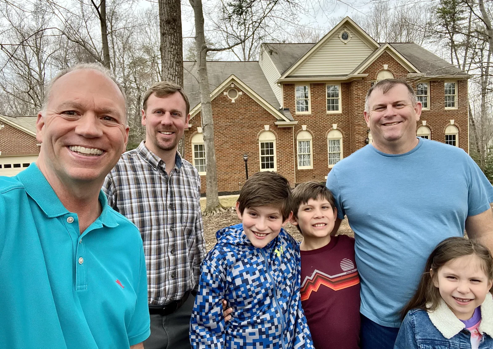 Bill Denny with happy clients in front of their new Northern Virginia home